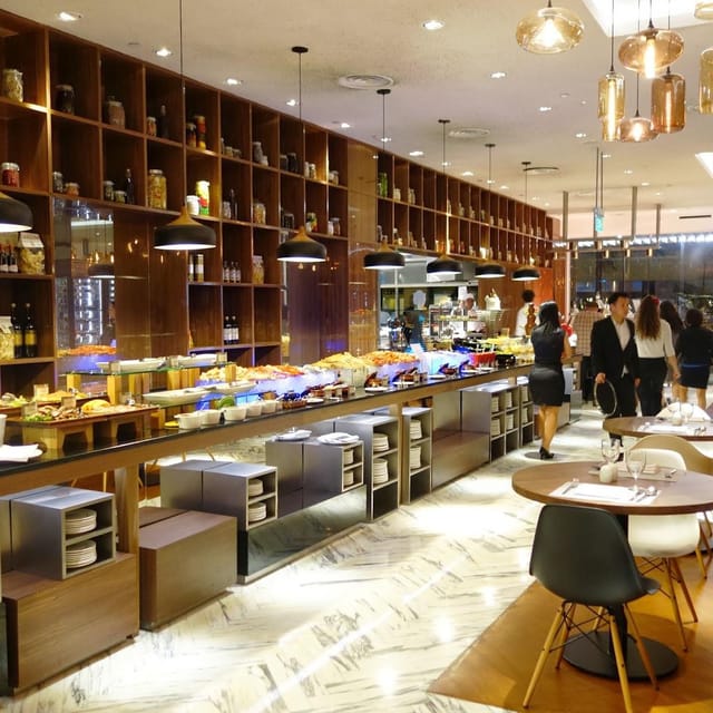 Upscale Amara Singapore hotel buffet with shelving for breakfast and lunch events.