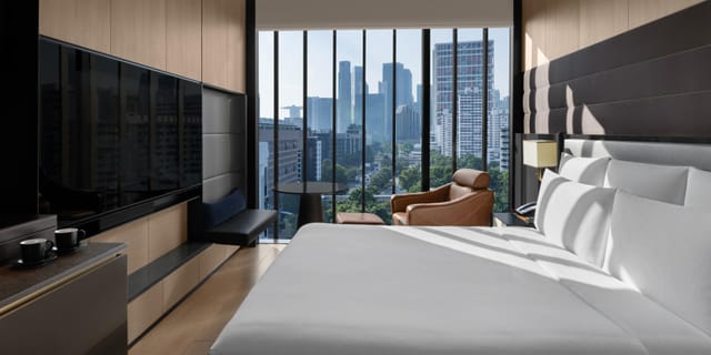 The Residence guest room in InterContinental Singapore with workstation for corporate business travel.