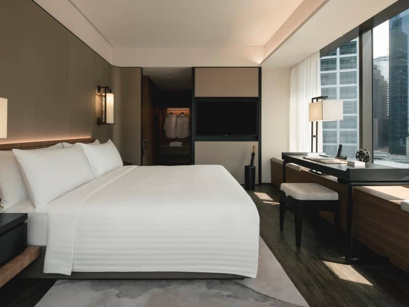 The Clan Hotel premium guest room with workspace for luxury business travel and VIP events.