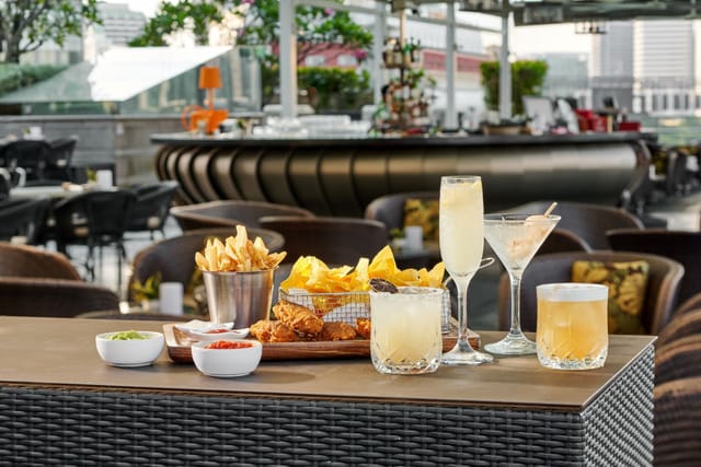 Luxe rooftop bar for networking reception and corporate event with premium drink service.
