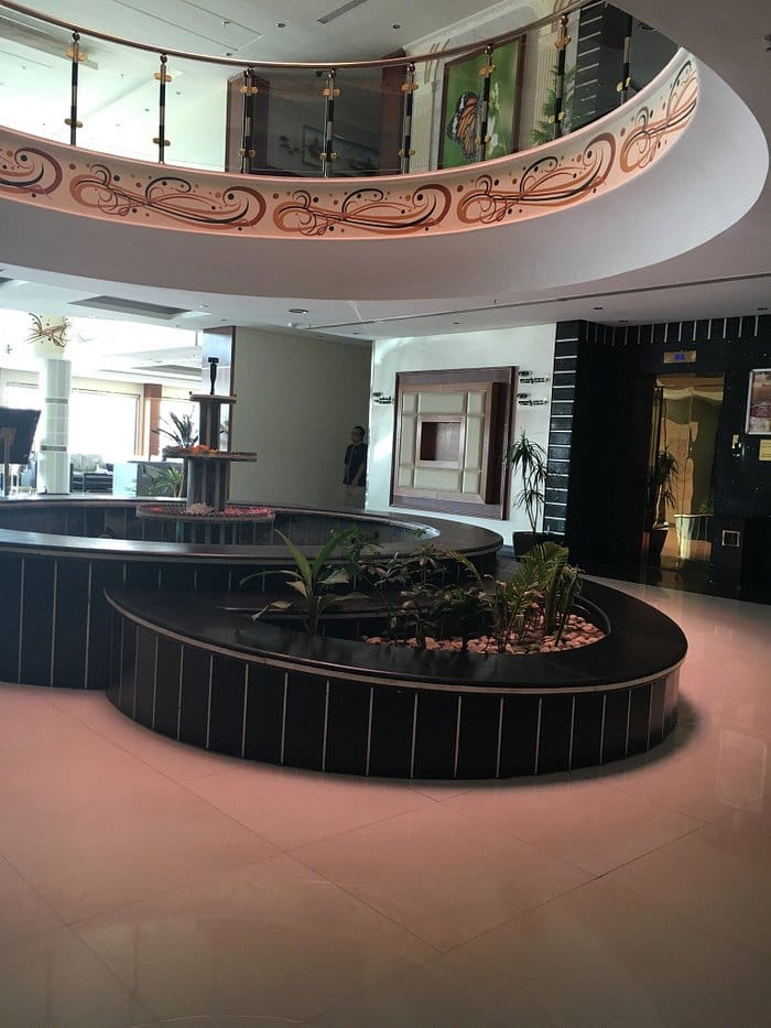 Meral Crown Hotel atrium meeting space with central fountain for corporate events and conferences.