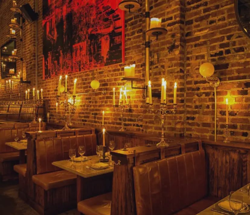 Sadelle’s NYC private dining room with leather banquettes, ideal for VIP networking events.