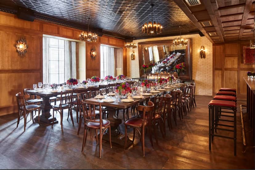Dirty French private dining room with wood paneling for executive dinners and board events.