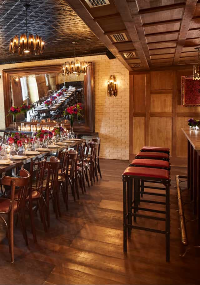 Dirty French private dining room with banquet table for intimate events and corporate meetings.