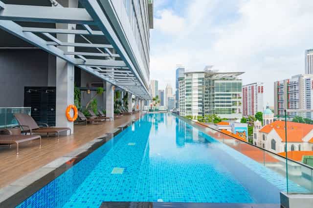 Straits Poolside rooftop venue with city skyline for VIP networking and cocktail events.