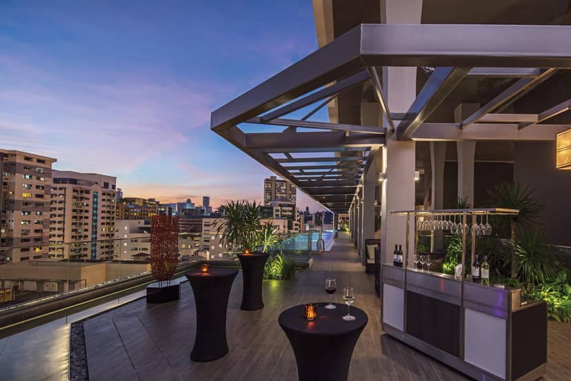Straits Poolside rooftop bar at sunset, perfect for corporate networking and cocktail events.