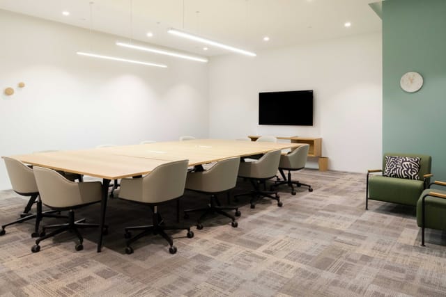 Contemporary boardroom at Spaces Triple One Somerset for hybrid meetings and collaborative workshops.