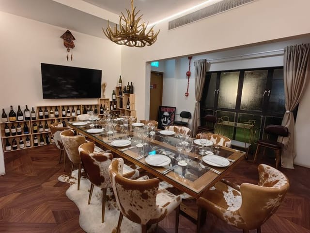 Rustic private dining room with cowhide seating, ideal for executive meetings and intimate events.