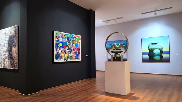 Gallery space for luxury networking reception and VIP corporate event.