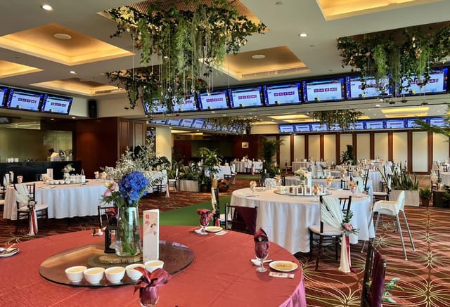 Singapore Turf Club banquet room with floral decor for hybrid corporate events and conferences.