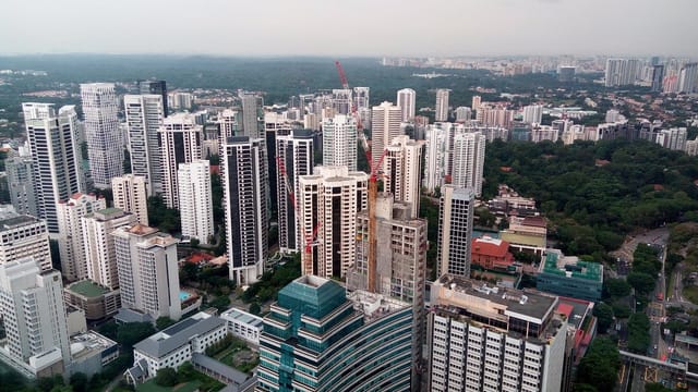 ION Sky observation deck overlooking Singapore urban development and convention hub.