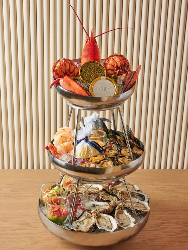 Luxury seafood tower at Maison Boulud for upscale networking receptions and VIP dinners.