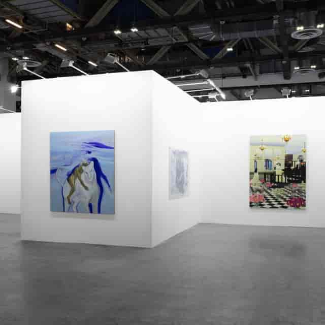Minimalist ART SG trade show booth with white gallery walls for art fair exhibitions.