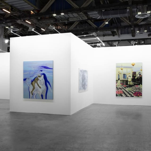Minimalist ART SG trade show booth with white gallery walls for art fair exhibitions.