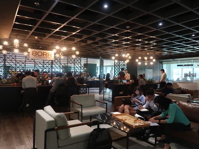 Modern coworking lounge at 80RR Fintech Hub SG for corporate meetings and networking events.