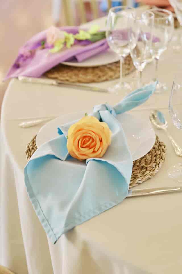 Elegant place setting with floral accent at New Victorian Loft for spring wedding and gala events.