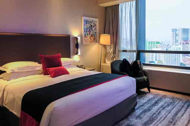 Modern Carlton Club Room with king bed for executive retreats and VIP business travel.