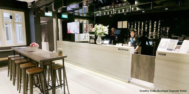 Modern Cube Boutique Hotel lounge with tour desk for event check-in and excursion management.