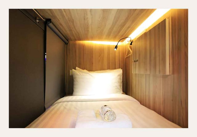 Private room in Cube Boutique Capsule Hotel: efficient lodging for conference and budget travel.