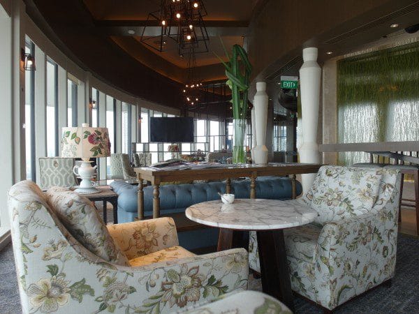 Upscale lounge with marble tables, ideal for VIP networking and intimate corporate breakout sessions.