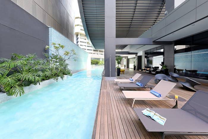 Pan Pacific Orchard pool deck: luxury incentive travel and corporate networking breakout space.
