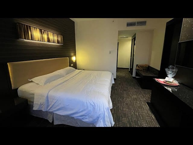 Modern Hotel Royal suite with workspace, ideal for business travel and corporate lodging.
