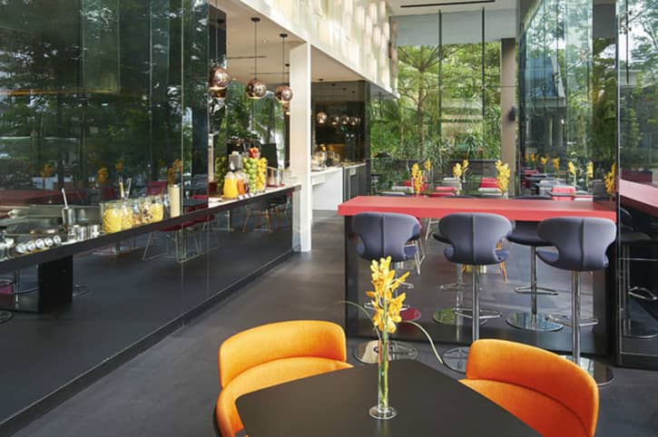 Modern hotel lounge with bar seating for corporate breakout sessions and networking events.