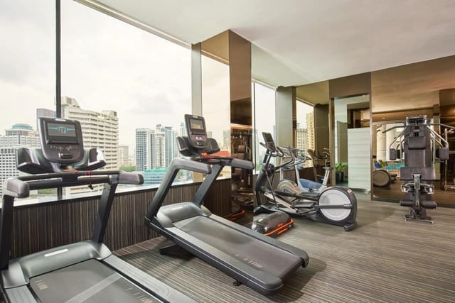Luxury hotel fitness center in Quincy Hotel Singapore for conference wellness.