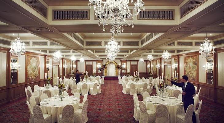 Luxury Raffles Sentosa ballroom with crystal chandeliers for weddings and corporate galas.