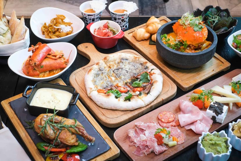 Gourmet banquet spread on wooden boards for VIP luncheon and networking catering.