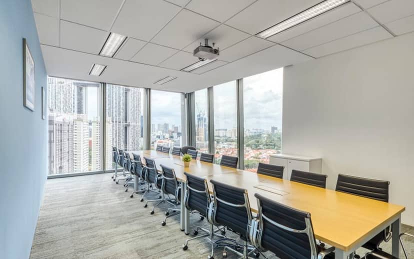 Guoco Tower boardroom with floor-to-ceiling windows for professional corporate strategy meetings.