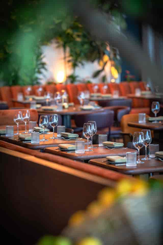 Elegant dining setup in Agora Hall, HERA Restaurant for upscale corporate events.