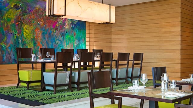 Contemporary dining room with mural for executive board lunches and private dinner events.