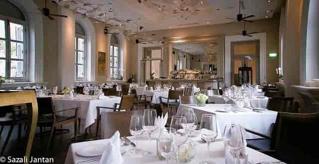 Flutes Restaurant banquet setup with white linens for corporate dinners and VIP hospitality events.