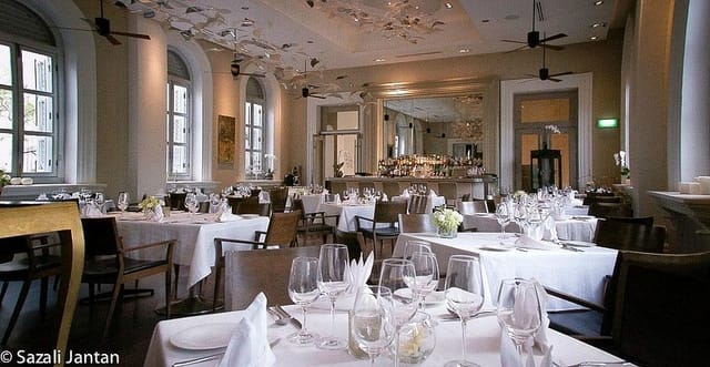 Flutes Restaurant banquet setup with white linens for corporate dinners and VIP hospitality events.