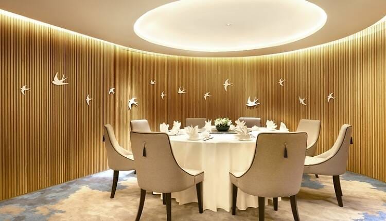 VIP private dining room with acoustic wall paneling for corporate meetings and executive lunches.