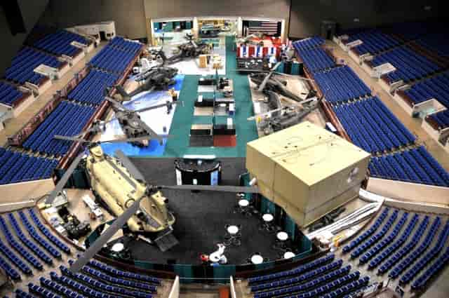 Heavy equipment in Fort Worth Convention Center tiered arena for experiential marketing event.