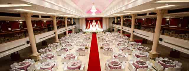 Grand Ballroom at Orchid Country Club with red carpet aisle for wedding or gala event venue.
