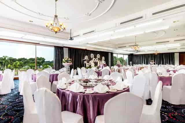 Sapphire Suite banquet hall with purple tables, perfect for weddings and corporate gala events.