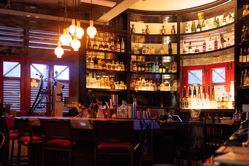1939 Singapore bar with moody lighting, ideal for VIP networking and corporate reception events.