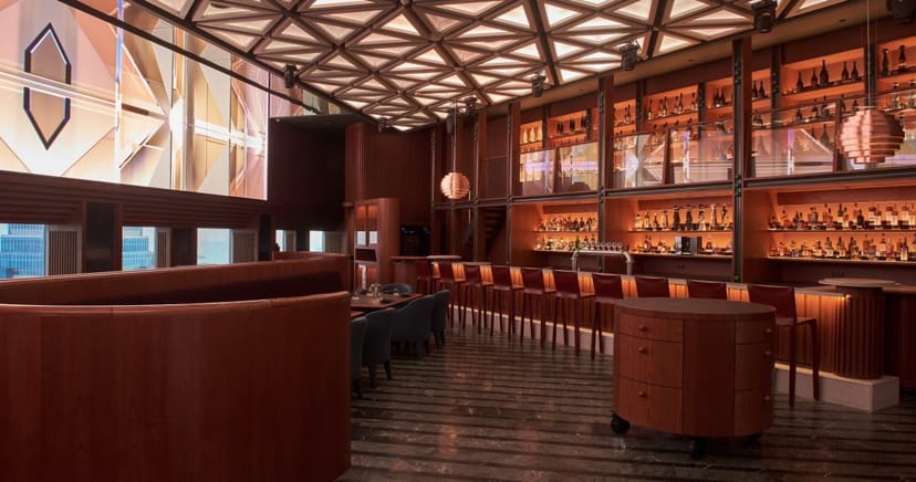 High-end lounge bar with tiered shelving for VIP receptions and networking mixers.
