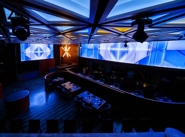 High House bar with geometric ceiling for VIP brand activations and evening receptions.