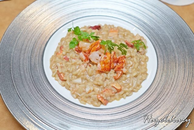 Lobster risotto entrée for a luxury gala dinner event.