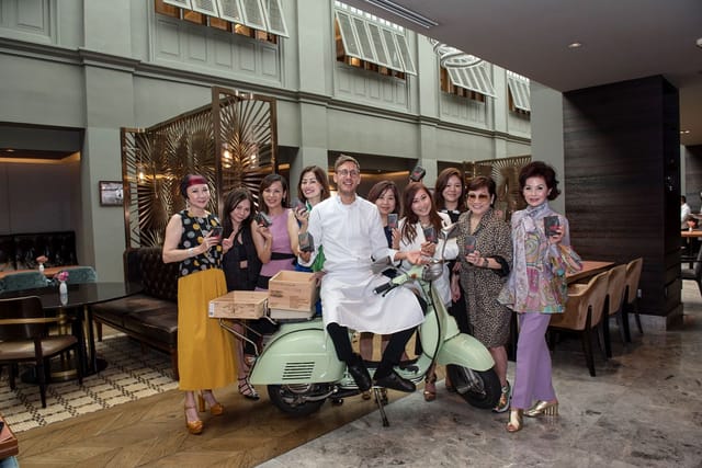 Celebrity chef performing at LUCE dining area for upscale hospitality brand activation event.
