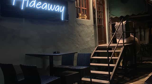 Neon-lit HIDEAWAY dining room for intimate VIP breakout sessions and exclusive networking events.