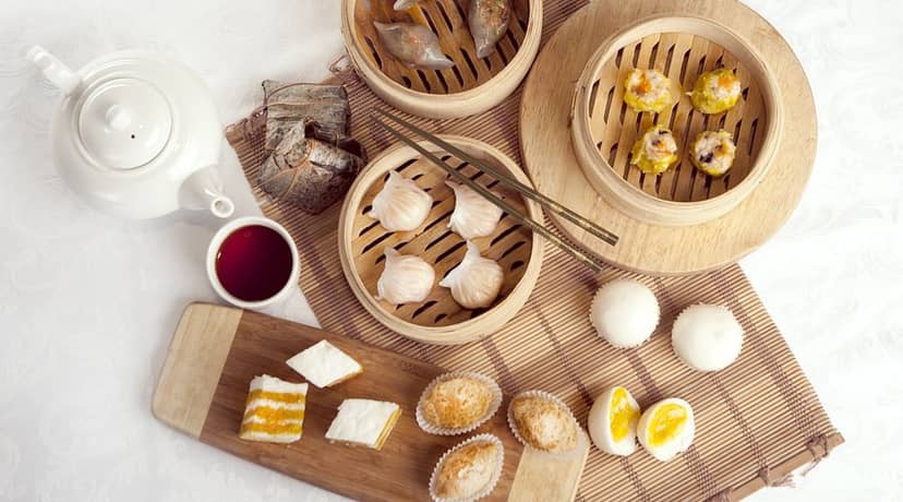 Dim sum brunch catering in bamboo steamers for high-end corporate networking events.