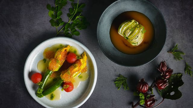 Plant-forward catering for luxury gala or VIP dinner with sophisticated aesthetic plating.