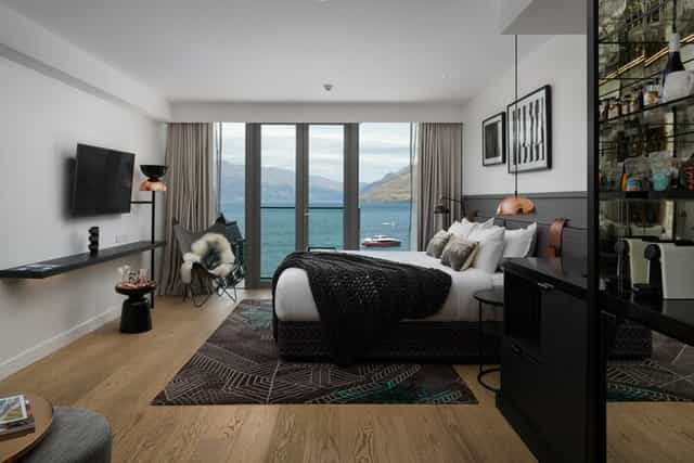 Luxury Rees suite at QT Queenstown with scenic views for incentive travel and VIP events.