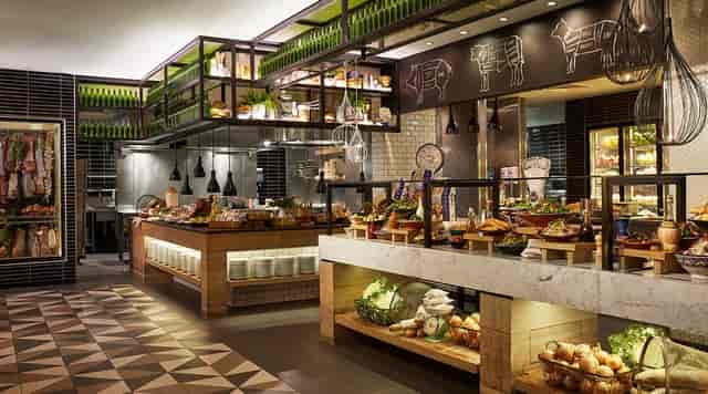 Bazaar Restaurant buffet, industrial-chic design, ideal for networking events and corporate functions.