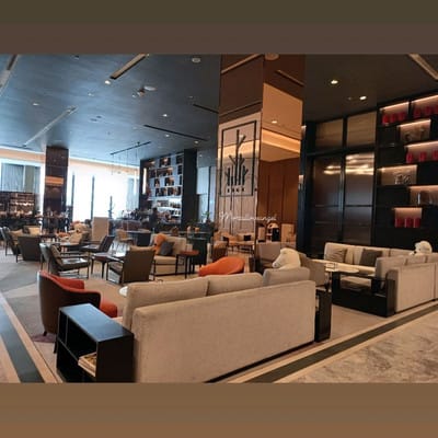 Modern hotel lobby lounge for networking and conference breakout meetings.